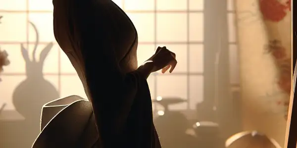 A sensuous side silhouette of a figure, highlighted by soft lighting and traditional Japanese elements.